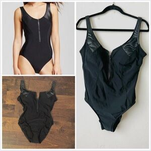 Black one piece swimsuit with zipper and faux leather details
